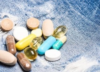 Medicine prescription. Health care and illness. Dose and addiction. Drug addiction. Medicine and treatment concept. Drugs on denim background. Set of colorful pills. Mixing medicines. Fast treatment.