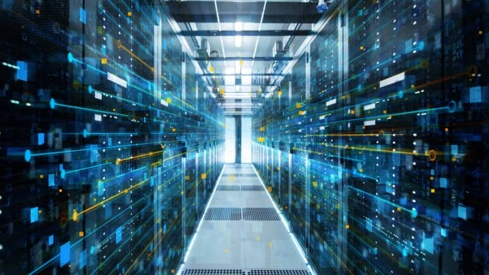 Adobe Stock royalty-free image #200146313, 'Shot of Corridor in Working Data Center Full of Rack Servers and Supercomputers with Internet connection Visualisation Projection.' uploaded by Gorodenkoff, standard license purchased from https://stock.adobe.com/images/download/200146313; file retrieved on May 9th, 2019. License details available at https://stock.adobe.com/license-terms - image is licensed under the Adobe Stock Standard License