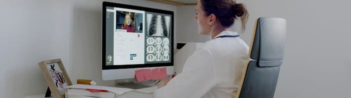 Caucasian female doctor delivering telemedicine consultation to a patient. Telehealth, telemedicine, remote consultation service. Coronavirus, COVID-19