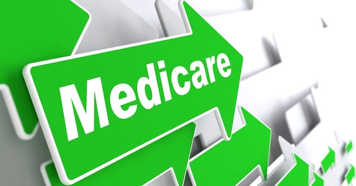 Medicare - Medical Concept. Green Arrow with "Medicare" Slogan on a Grey Background. 3D Render.