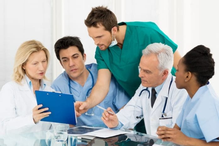 Team Of Experts Doctors Examining Medical Exams