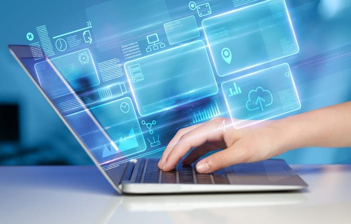 Hand using laptop with database reports and online work concept