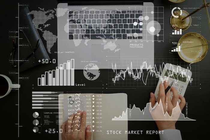 Investor analyzing stock market report and financial dashboard with business intelligence (BI), with key performance indicators (KPI).justice and law concept.businessman or lawyer or accountant working.