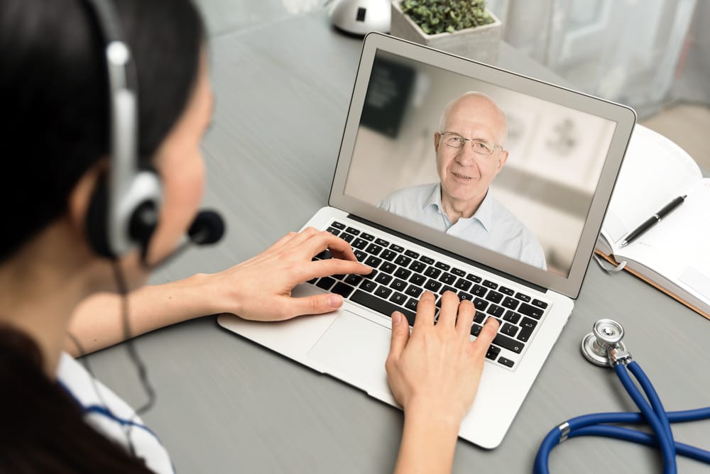 Doctor talking with a senior patient. Telemedicine concept