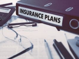 Insurance Plans - Ring Binder on Office Desktop with Office Supplies. Business Concept on Blurred Background. Toned Illustration.