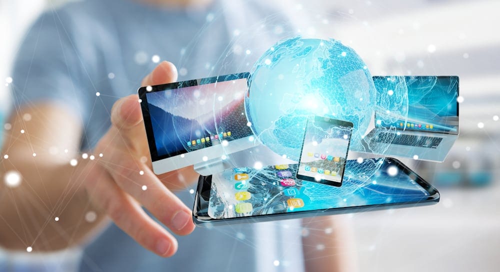 Businessman connecting tech devices and icons applications with each other 3D rendering