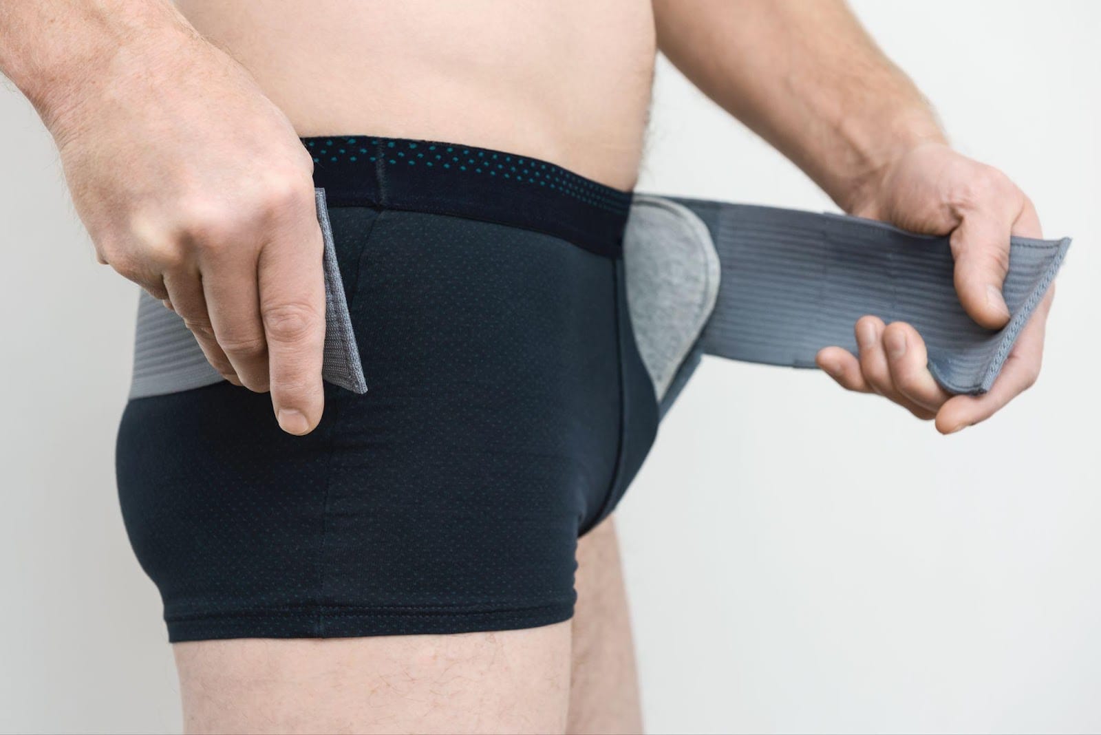 Photo of a man with a hernia belt for an article about how tight should a hernia belt be