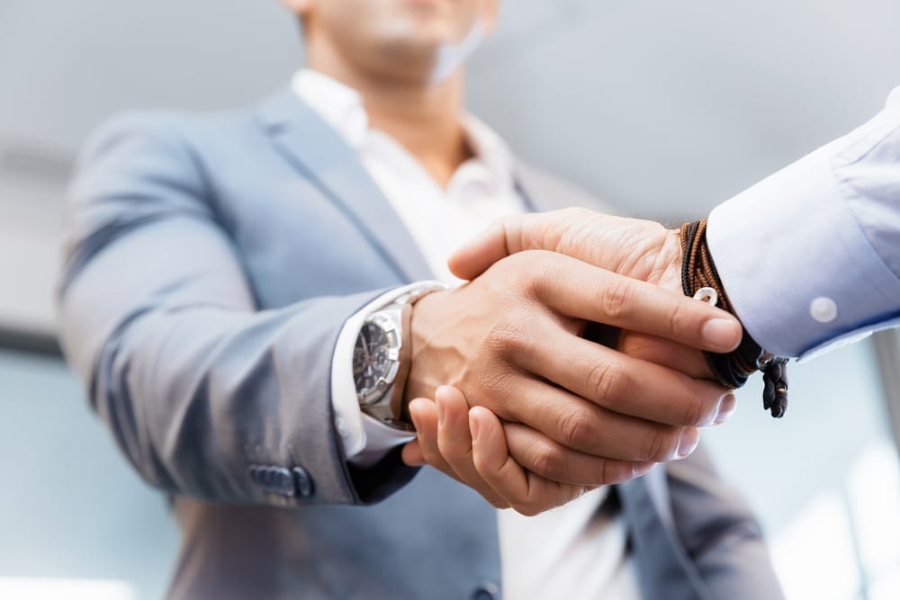 Handshake of businessmen greeting each other