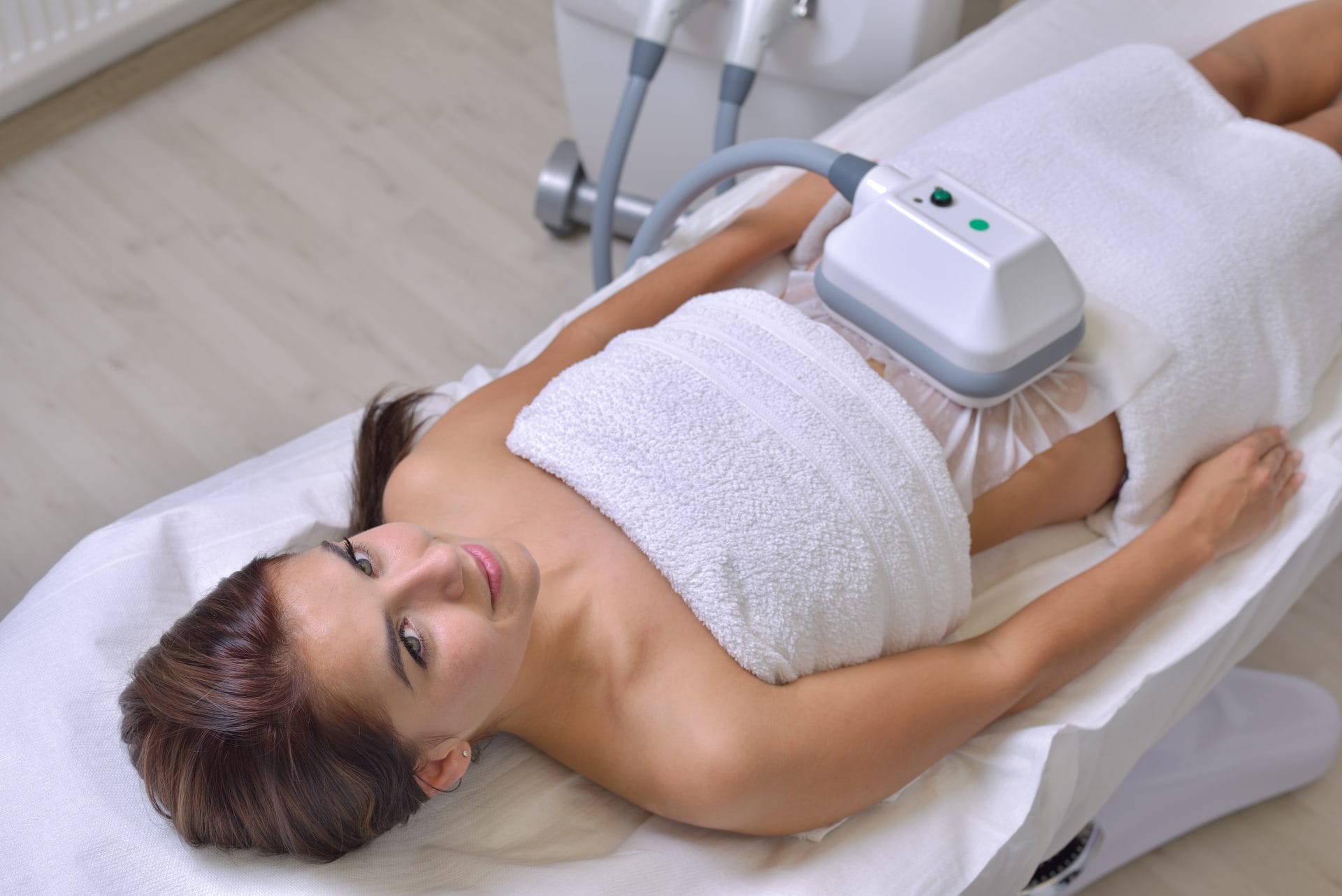 Non-Invasive Fat Removal: woman getting an ultrasound on her belly