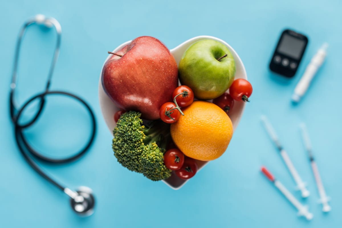 Picture of a heart with fruits depicting blood sugar levels