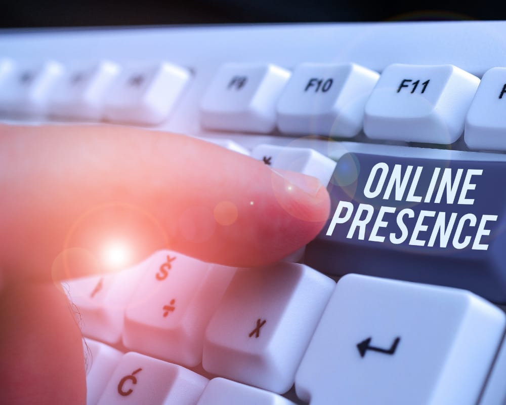 Person pushing a keyboard button with the words Online Presence