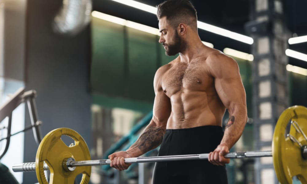 Image of a man working out for an article on Best Supplements for Weight Lifters