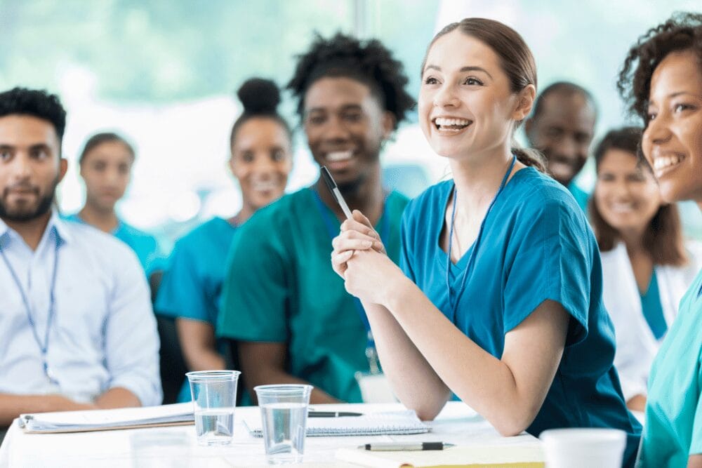 Team of nurses sitting in a eeting