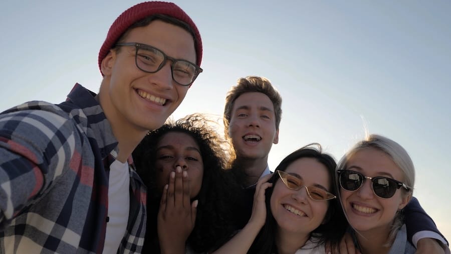 Slow motion. Group of happy multiethnic teenagers taking a selfie. Professional shot in 4K resolution. 035. You can use it e.g. in your commercial video, medical, business, presentation, broadcast