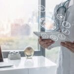 Doctor using digital tablet with AI-powered healthcare icons and medical data visualization, symbolizing artificial intelligence and technology integration in modern medicine.